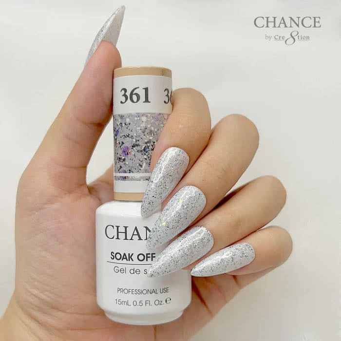 Chance Diamond Dust 361 soak-off gel polish 0.5 oz, bottle held in hand with painted nails