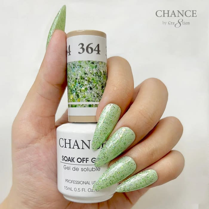 Chance Diamond Dust 364 soak-off gel polish 0.5 oz, bottle held in hand with painted nails