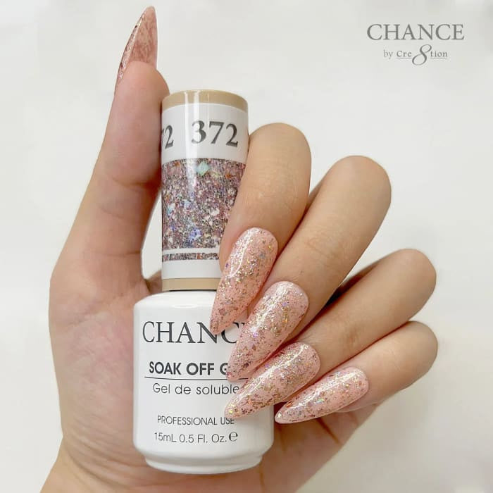Chance Diamond Dust 372 soak-off gel polish 0.5 oz, bottle held in hand with painted nails
