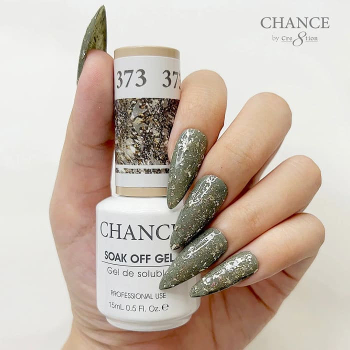 Chance Diamond Dust 373 soak-off gel polish 0.5 oz, bottle held in hand with painted nails