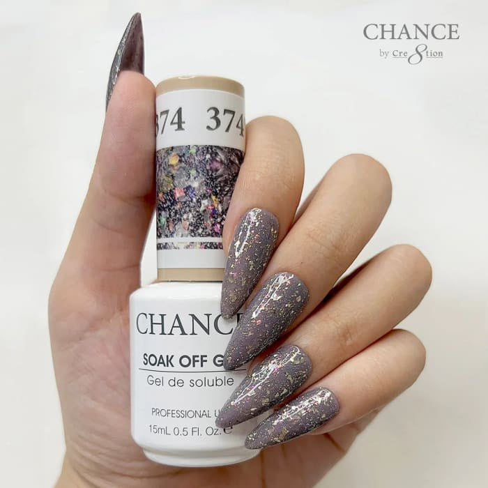 Chance Diamond Dust 374 soak-off gel polish 0.5 oz, bottle held in hand with painted nails