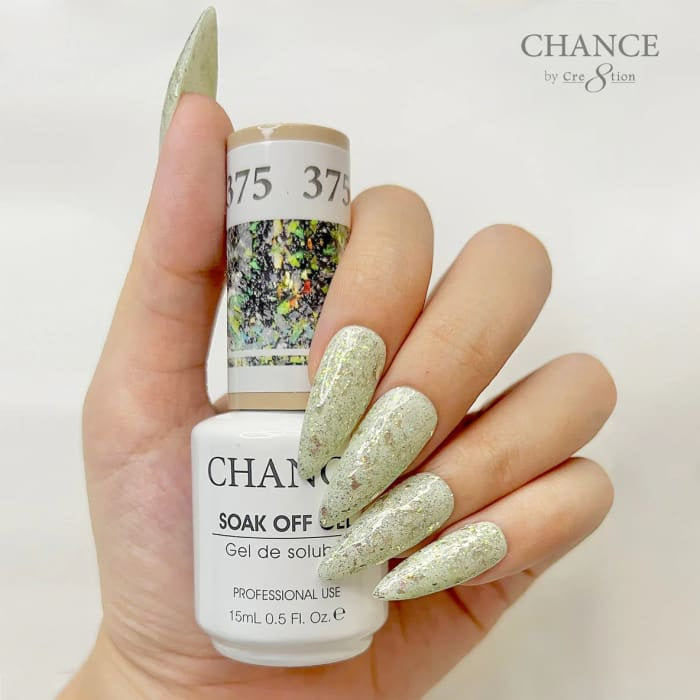 Chance Diamond Dust 375 soak-off gel polish 0.5 oz, bottle held in hand with painted nails