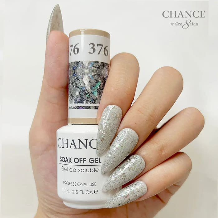 Chance Diamond Dust 376 soak-off gel polish 0.5 oz, bottle held in hand with painted nails