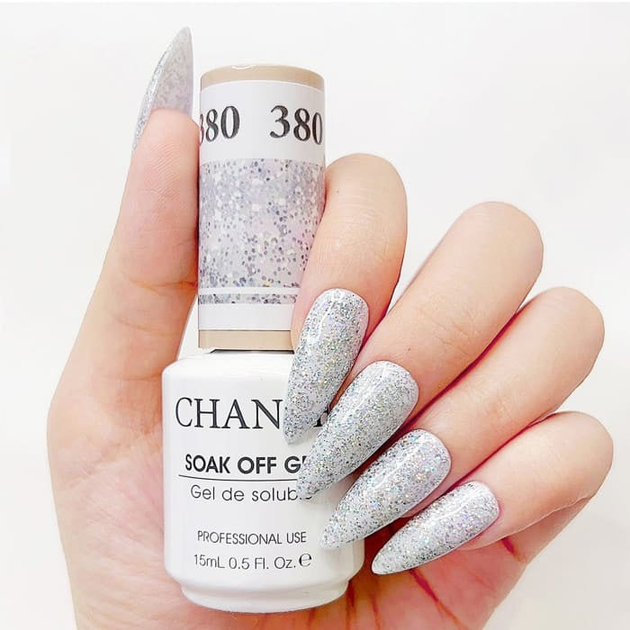 Chance Diamond Dust 380 soak-off gel polish 0.5 oz, bottle held in hand with painted nails
