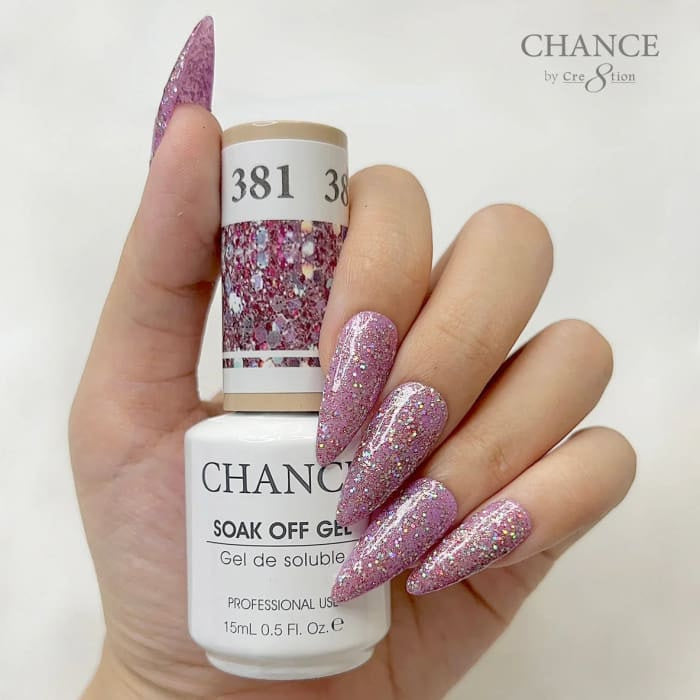 Chance Diamond Dust 381 soak-off gel polish 0.5 oz, bottle held in hand with painted nails